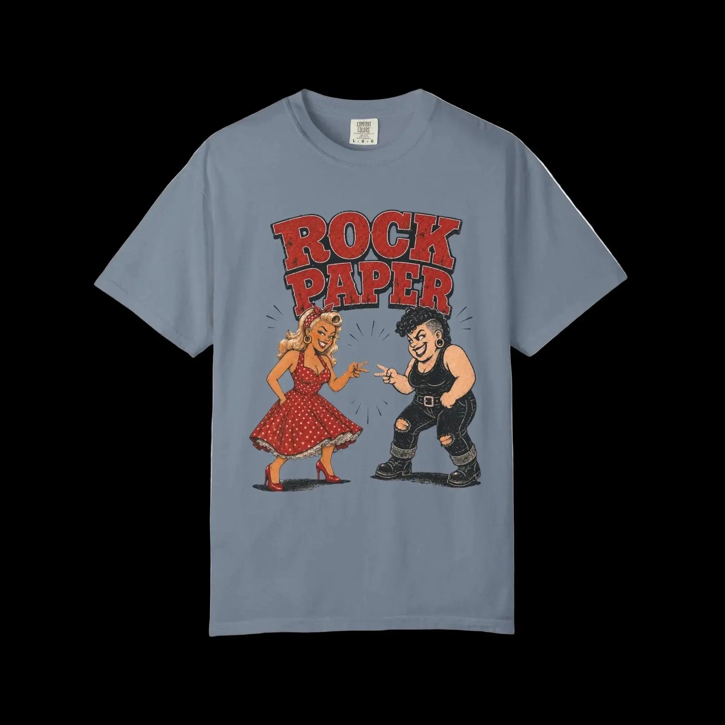 Vintage rockabilly pinup and tattooed character facing off beneath Rock Paper typography on blue Jean colored shirt
