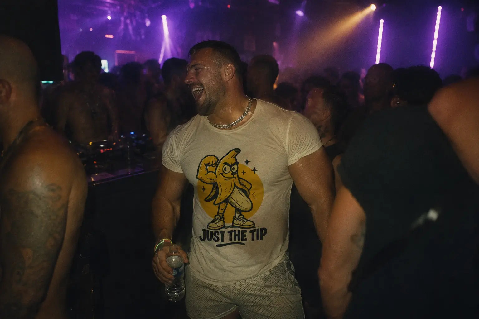 Man wearing ‘Just The Tip’ graphic tee vintage white at circuit party in nightclub 
