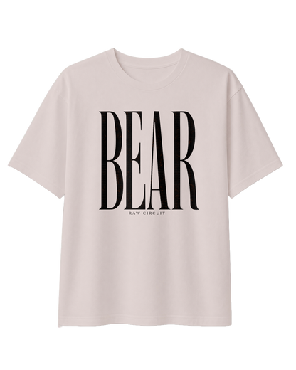 Front view of the RAW CIRCUIT BEAR graphic tee in Dust, featuring oversized, vertically stretched black serif lettering centered on the chest, with a small RAW CIRCUIT signature beneath the design.