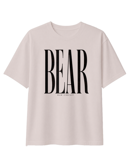 Front view of the RAW CIRCUIT BEAR graphic tee in Dust, featuring oversized, vertically stretched black serif lettering centered on the chest, with a small RAW CIRCUIT signature beneath the design.