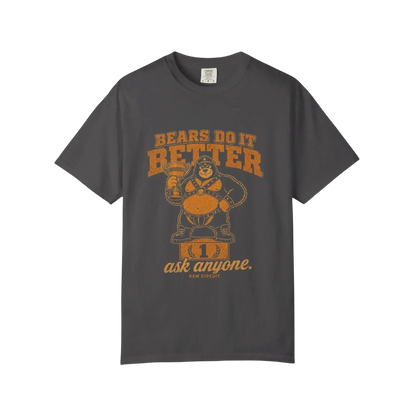 Leather bear mascot standing on a winner's podium holding a trophy labeled Obviously beneath Bears Do It Better typography on graphite shirt.