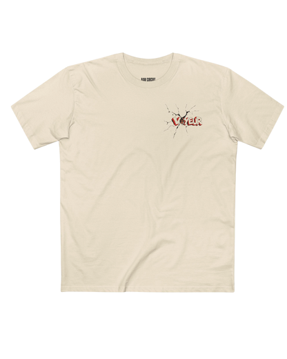 Natural-colored RAW CIRCUIT VOYEUR graphic tee with a small distressed red-and-ivory wordmark and black cracked details on the left chest.